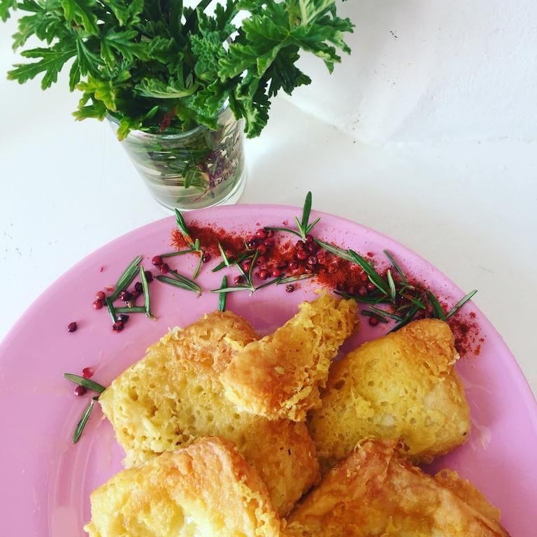 view from above of a plate with pieces of tiropita from Greek Cooking Class from Two Minutes Angie